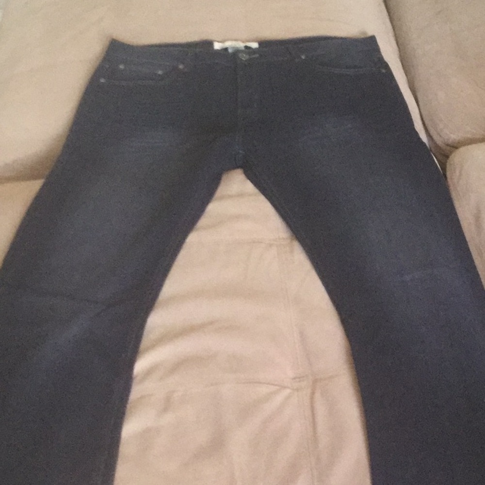 Men’s dark wash denim jeans.